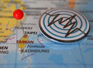 Map of Taiwan with a pin and earthquake symbol.