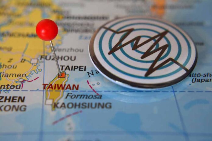 Map of Taiwan with a pin and earthquake symbol.