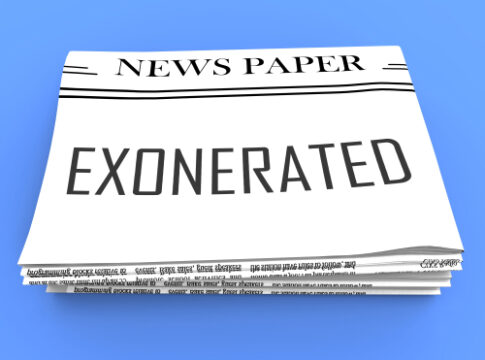 Newspaper with EXONERATED headline on the front page.