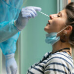 Person receiving a nasal swab COVID-19 test.