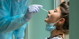 Person receiving a nasal swab COVID-19 test.