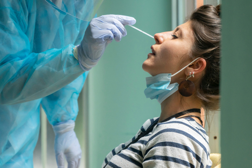 Person receiving a nasal swab COVID-19 test.