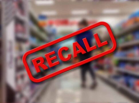 Recall text over blurred supermarket background.