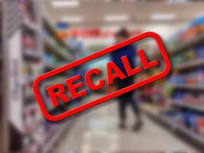 Recall text over blurred supermarket background.