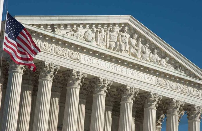 Supreme Court building facade with American flag.