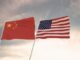 Chinese and American flags waving side by side.