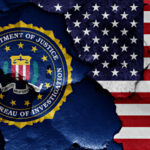 FBI logo beside partially torn American flag background.