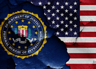 FBI logo beside partially torn American flag background.