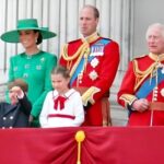 Royal family members on a balcony during a public event.