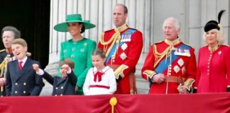 Royal family members on a balcony during a public event.