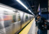 People waiting at 42nd Street subway station, New York City.