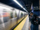 People waiting at 42nd Street subway station, New York City.