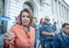 Nancy Pelosi speaking outside a government building.