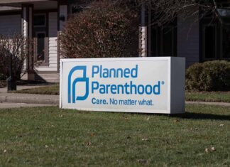 Planned Parenthood sign outside building.