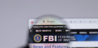 Website of FBI under magnifying glass.