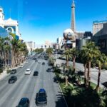 Las Vegas Boulevard with Eiffel Tower replica and hotels.