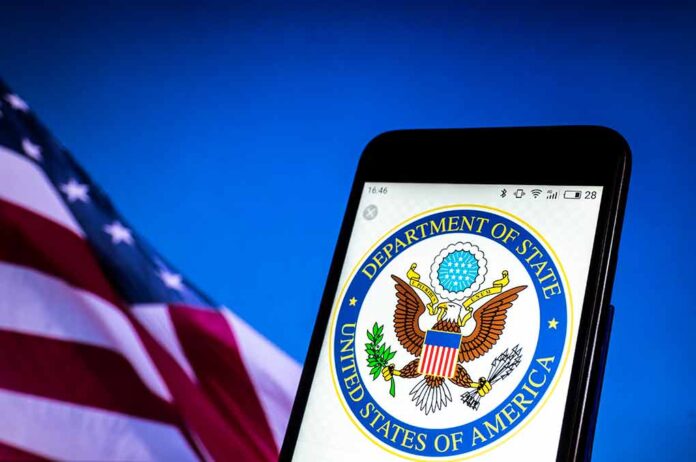 U.S. Department of State emblem on smartphone screen.