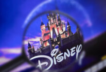 Disney castle logo magnified under a lens.