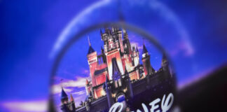 Disney castle logo magnified under a lens.