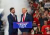 Two men at a political rally stage event