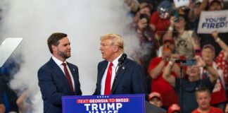 Two men at a political rally stage event