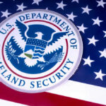 Killer MURDERS DHS Employee — Vetting DISASTER… US Homeland Security emblem over American flag