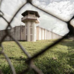 OUTRAGE: Texas Candidate TARGETS ‘American Zionists’ View of prison watchtower through chain-link fence.
