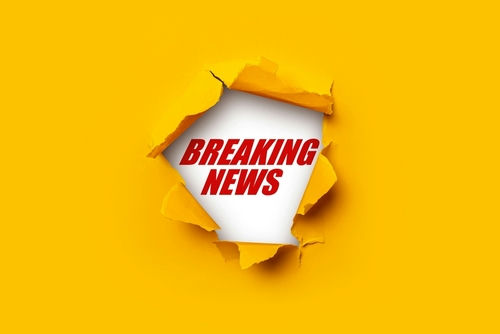 shutterstock2074082210-1jpg Breaking News text on yellow torn paper background.