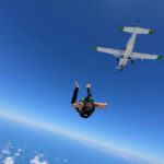 Skydiving SABOTAGE Wave—Friends Cutting Parachutes to KILL… Skydiver jumping from airplane in clear blue sky