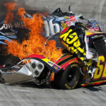 NASCAR car crash with fire on racetrack