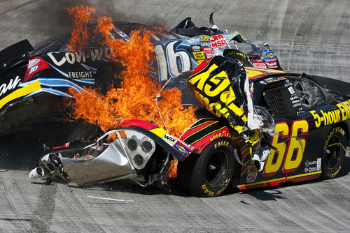 NASCAR car crash with fire on racetrack
