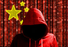A hooded figure in a red hoodie against a backdrop of binary code and stars representing China