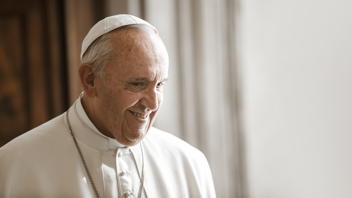 shutterstock_683238139.jpg Pope Francis smiling in a white robe and zucchetto