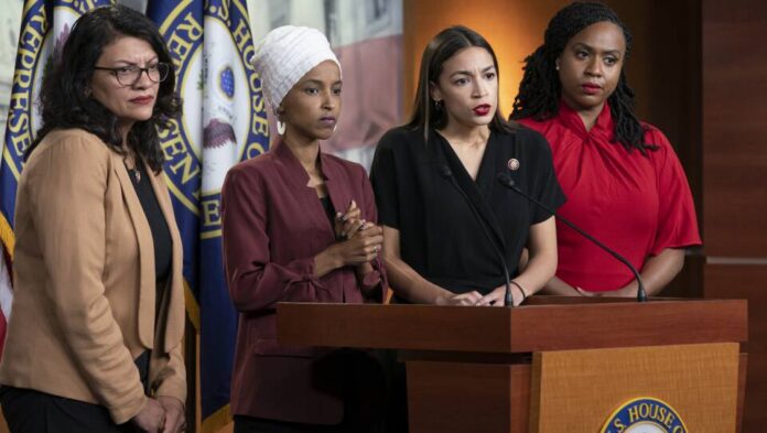 Four women politicians speaking at a press conference