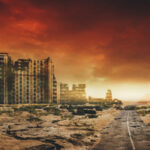 A desolate landscape featuring abandoned buildings under a dramatic sky