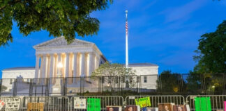 Protest signs outside the U.S. Supreme Court building.