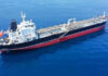 Oil tanker ship sailing on calm blue sea