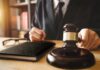 Judge with gavel striking sound block