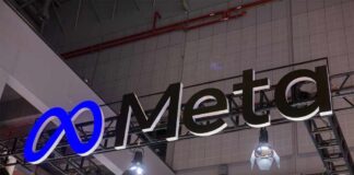 Meta logo sign hanging at a trade show booth
