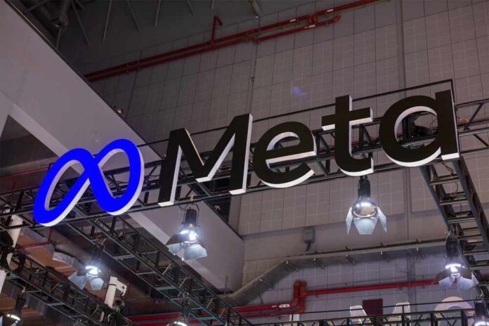Meta logo sign hanging at a trade show booth