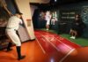 Wax figures of a baseball player and Serena Williams in a sports museum setting