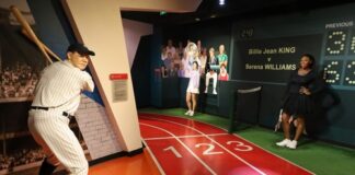 Wax figures of a baseball player and Serena Williams in a sports museum setting