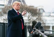 Assassination Rumors Swirl — Trump Named A man in a suit gesturing while speaking at a press conference outside the White House
