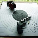 A Search for a Stolen Bike Ended in Tragedy Revolver and ear protection on paper shooting target