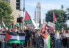 Protest Or Hate? Judge Drops Hammer Protesters holding signs and flags in a public square.
