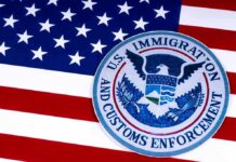 Defiance In Blue State: ICE Clash U.S. flag with ICE emblem