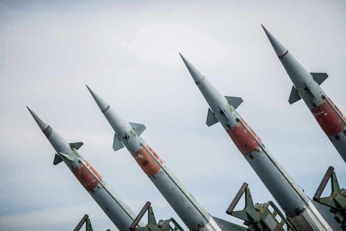 Four angled military missiles on launchers