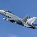Eurofighter Wins—But Only Up Close Twin-engine fighter jet climbing in a clear blue sky
