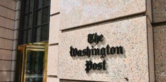 The Washington Post building entrance with logo on stone wall