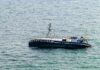 Alaska Standoff: Cruise Saves, Yacht Silent An abandoned boat floating on the ocean surface